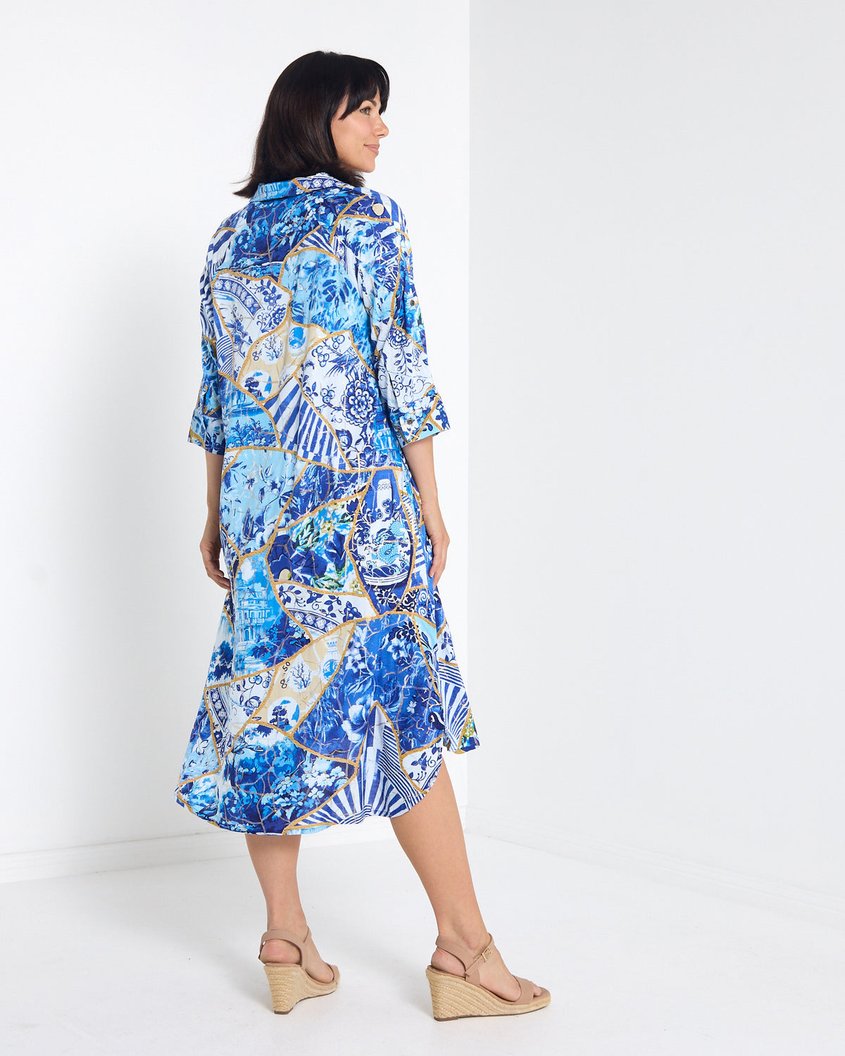 Mia Shirt Dress in patchwork print, back view showing the curved hem