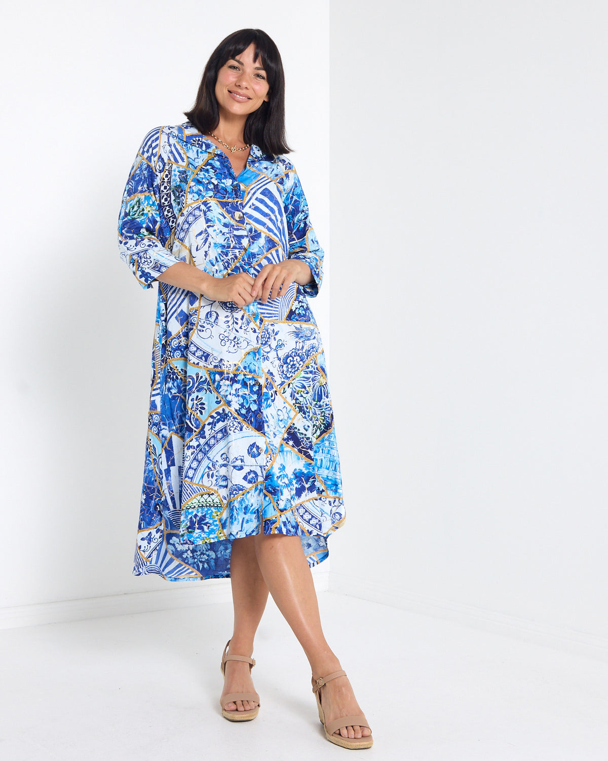 Mia Shirt Dress in patchwork print, front view showing the curved high-low hem