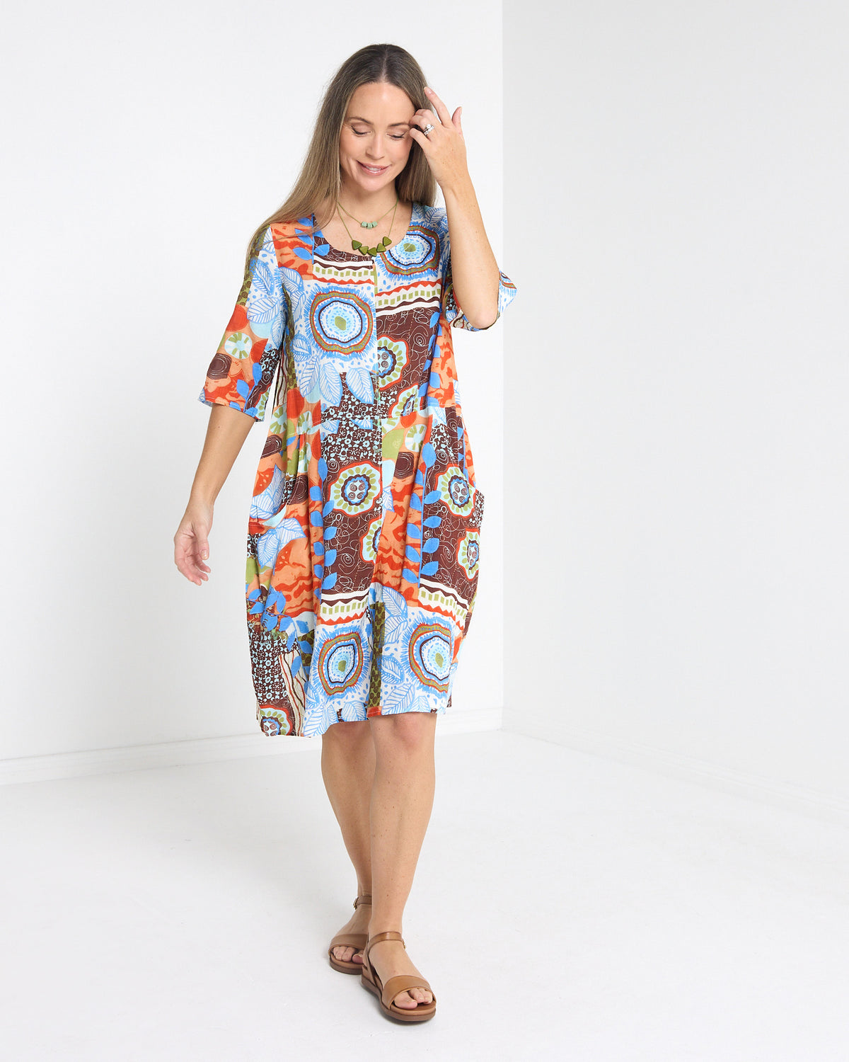 Eva Cotton Dress in ripple abstract print, front view in motion showing the relaxed cocoon shape