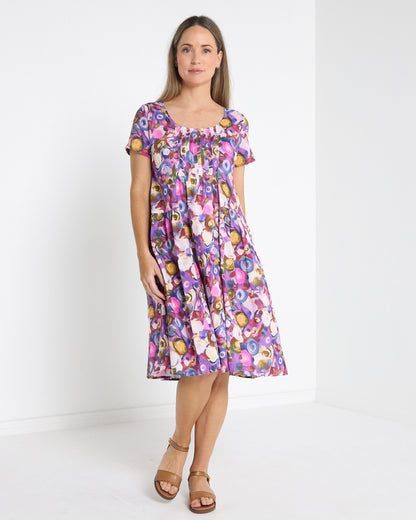 Emery Pintuck Dress in berry pop, front view showing the knee-length swing skirt