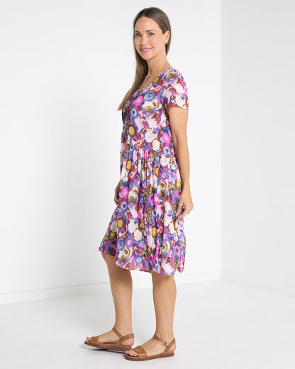 Emery Pintuck Dress in berry pop, side view showing the knee length
