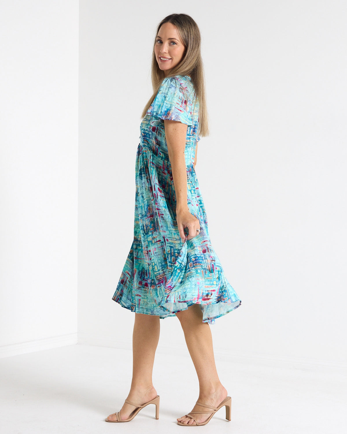 Cornwall Petite Dress in aqua mosaic print, side view showing the flutter sleeves and skirt movement