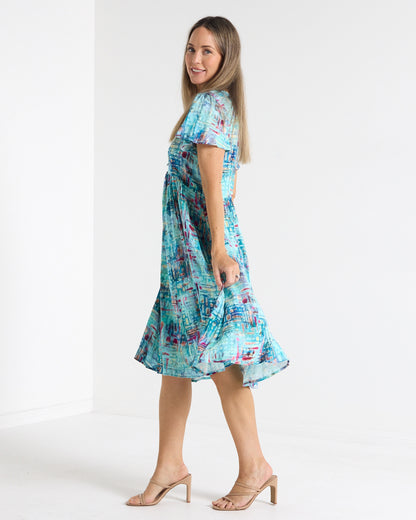 Cornwall Petite Dress in aqua mosaic print, side view showing the flutter sleeves and skirt movement