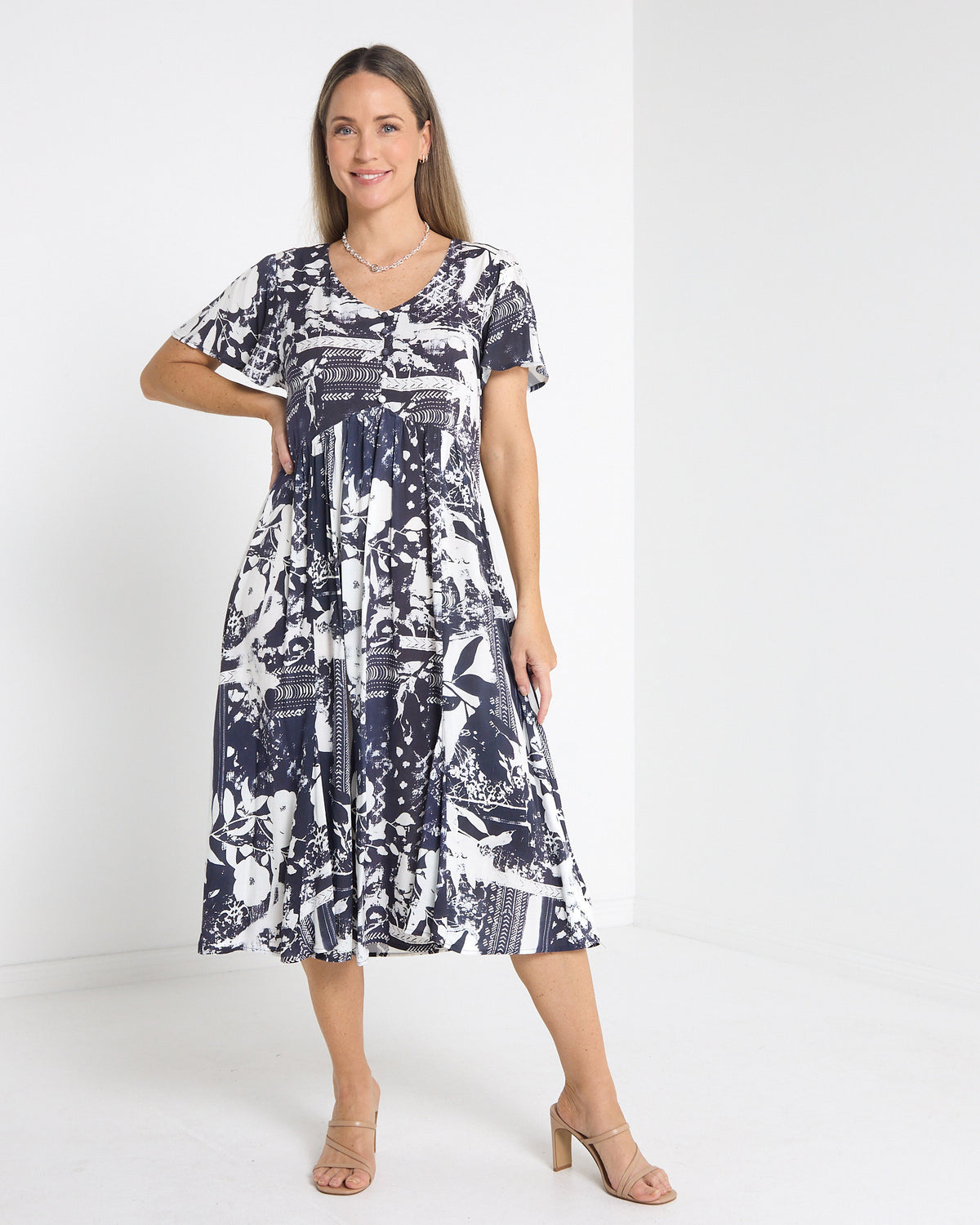 Cornwall Button Midi Dress in ink floral, front view with V neckline and flutter sleeves
