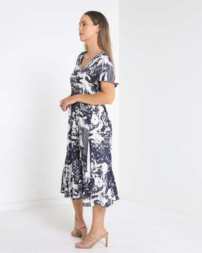 Cornwall Button Midi Dress in ink floral, side view showing the flutter sleeve and skirt