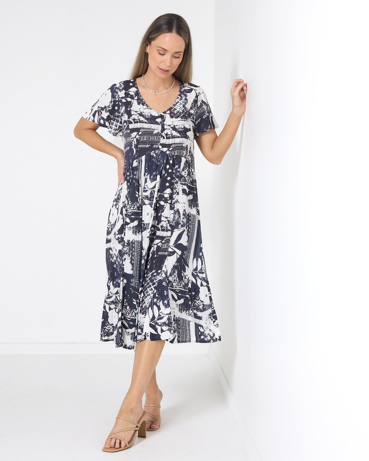 Cornwall Button Midi Dress in ink floral, front view with hand on hip