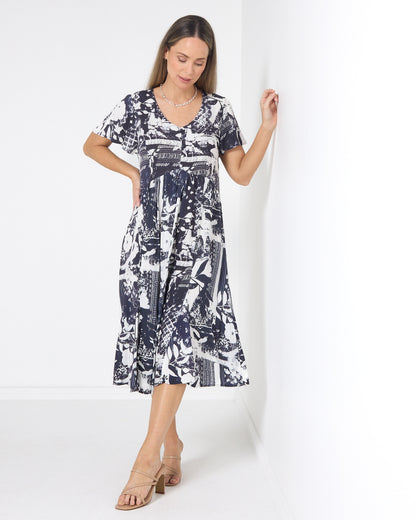 Cornwall Button Midi Dress in ink floral, front view with hand on hip