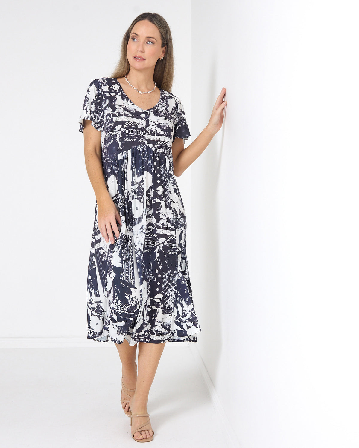 Cornwall Button Midi Dress in ink floral, three-quarter view showing the midi length