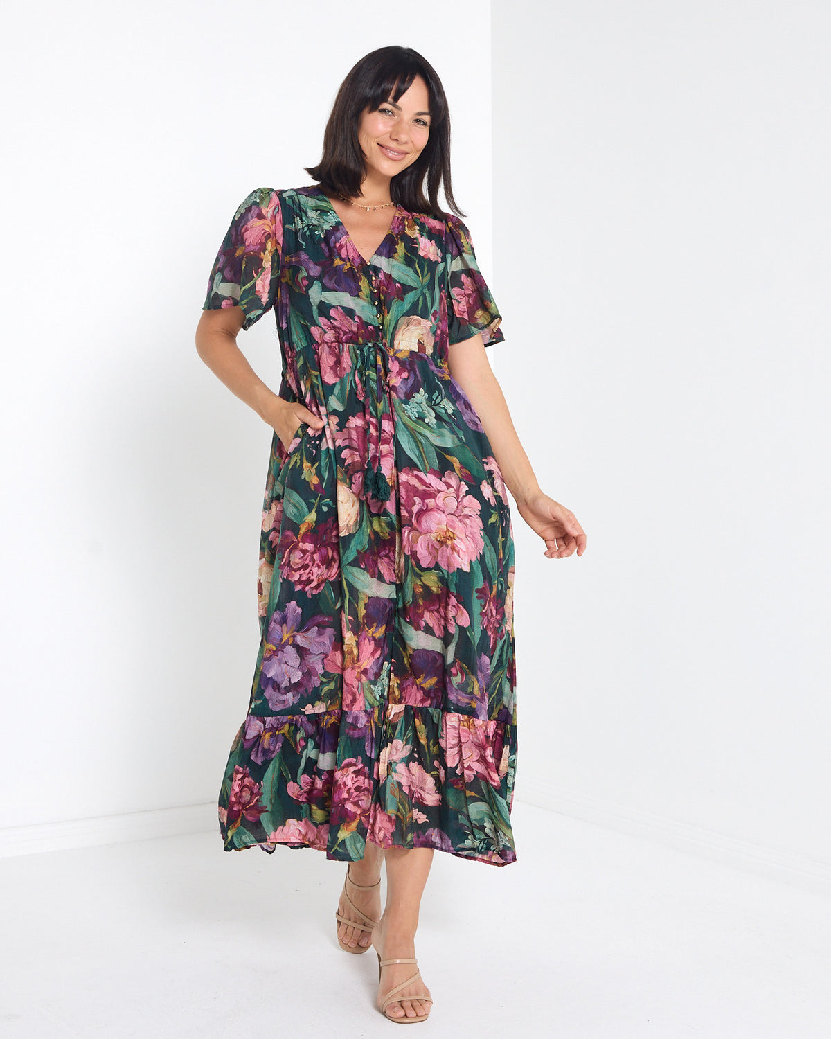 Cresida Party Dress in emerald floral, full-length front view with V neckline and flutter sleeves