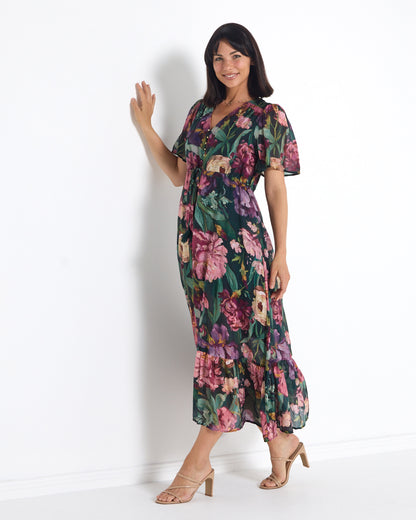 Cresida Party Dress in emerald floral, front view in motion showing the maxi length