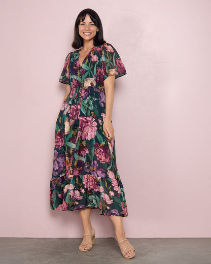 Cresida Party Dress in emerald floral, full-length front view with ruffle hem