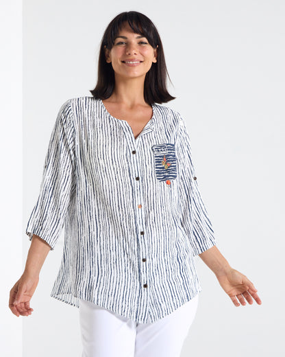 Gifford Stripe Blouse in navy, front view in motion showing the curved hem