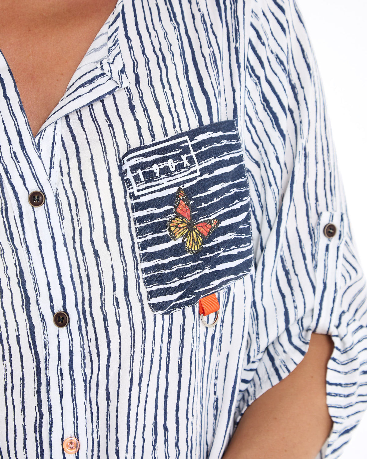 Gifford Stripe Blouse in navy, close-up of the embroidered butterfly patch pocket