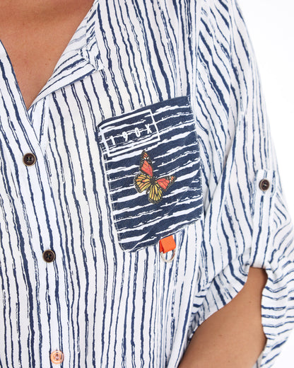 Gifford Stripe Blouse in navy, close-up of the embroidered butterfly patch pocket