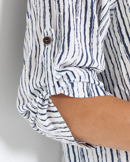 Gifford Stripe Blouse in navy, close-up of the button tab on the rolled sleeve