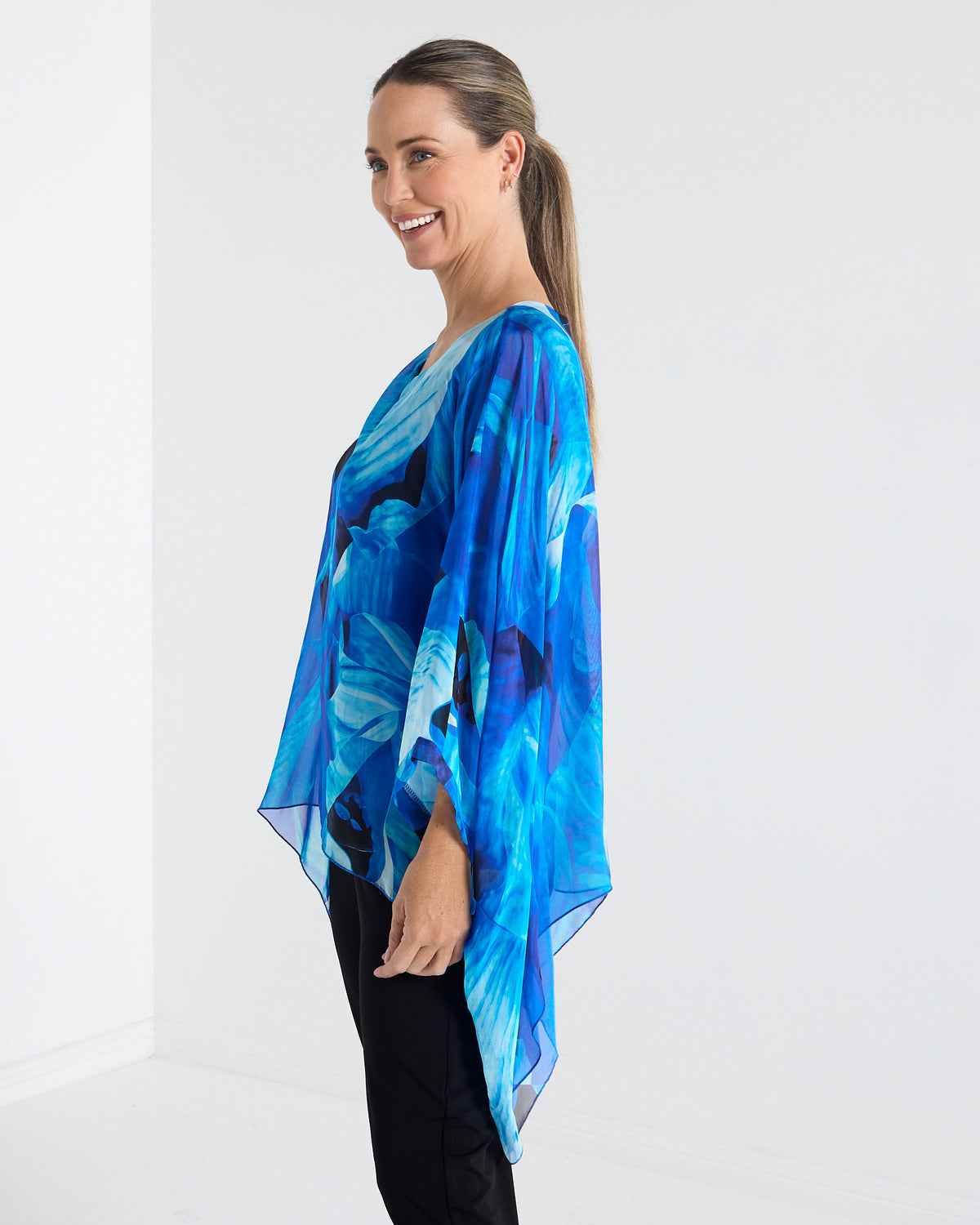 Palermo Silk Top in blue floral, side view showing the draped length