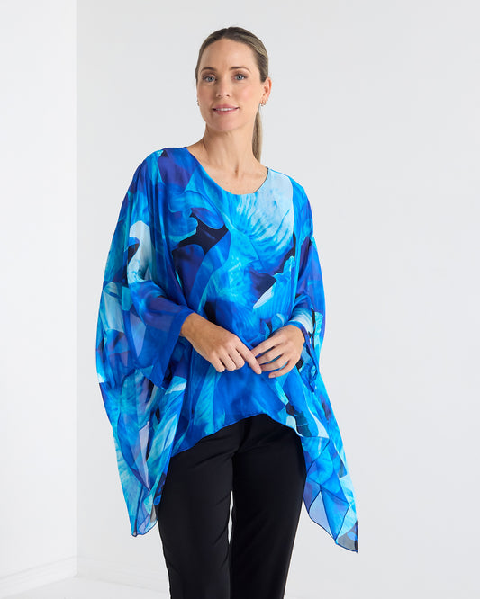 Palermo Silk Top in blue floral, front view showing the floaty poncho shape and round neckline