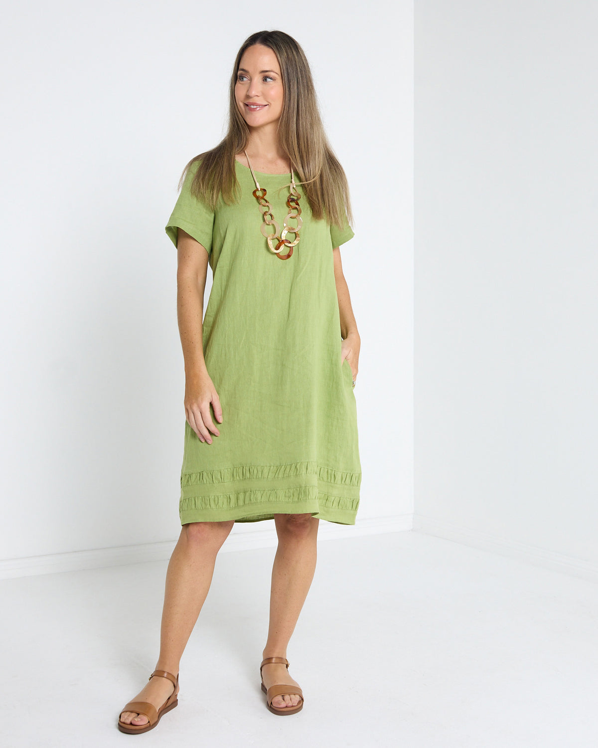 Lux Linen Shift Dress in pistachio, front view with short sleeves and textured trim hem