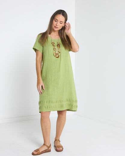 Lux Linen Shift Dress in pistachio, front view styled with a statement necklace