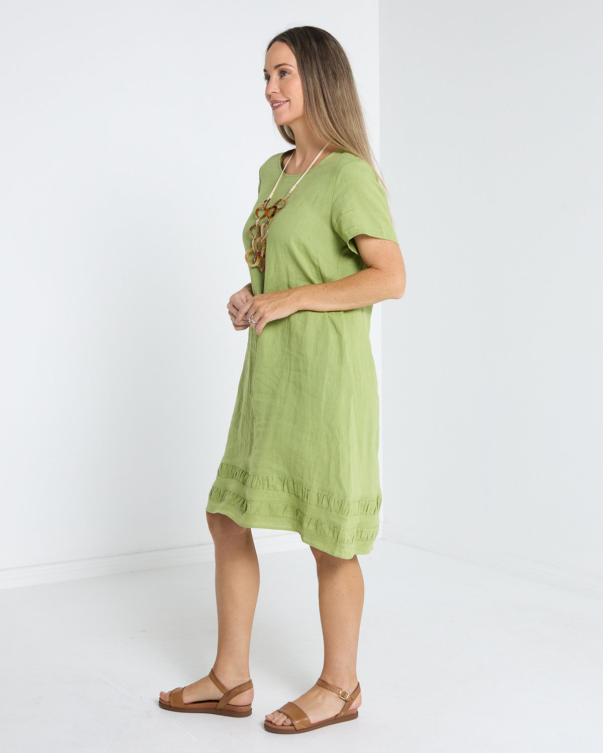Lux Linen Shift Dress in pistachio, side view showing the shift shape and knee length