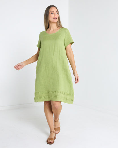 Lux Linen Shift Dress in pistachio, front view in motion showing the relaxed fit