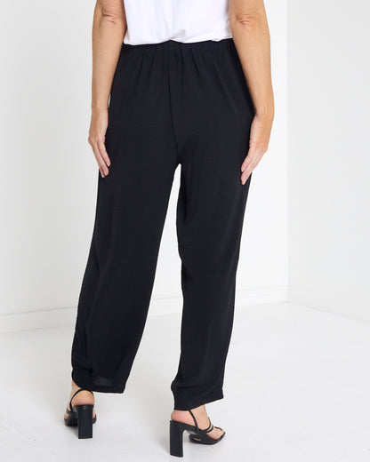 Venus Drawstring Tapered Pants in black, back view with elastic waist