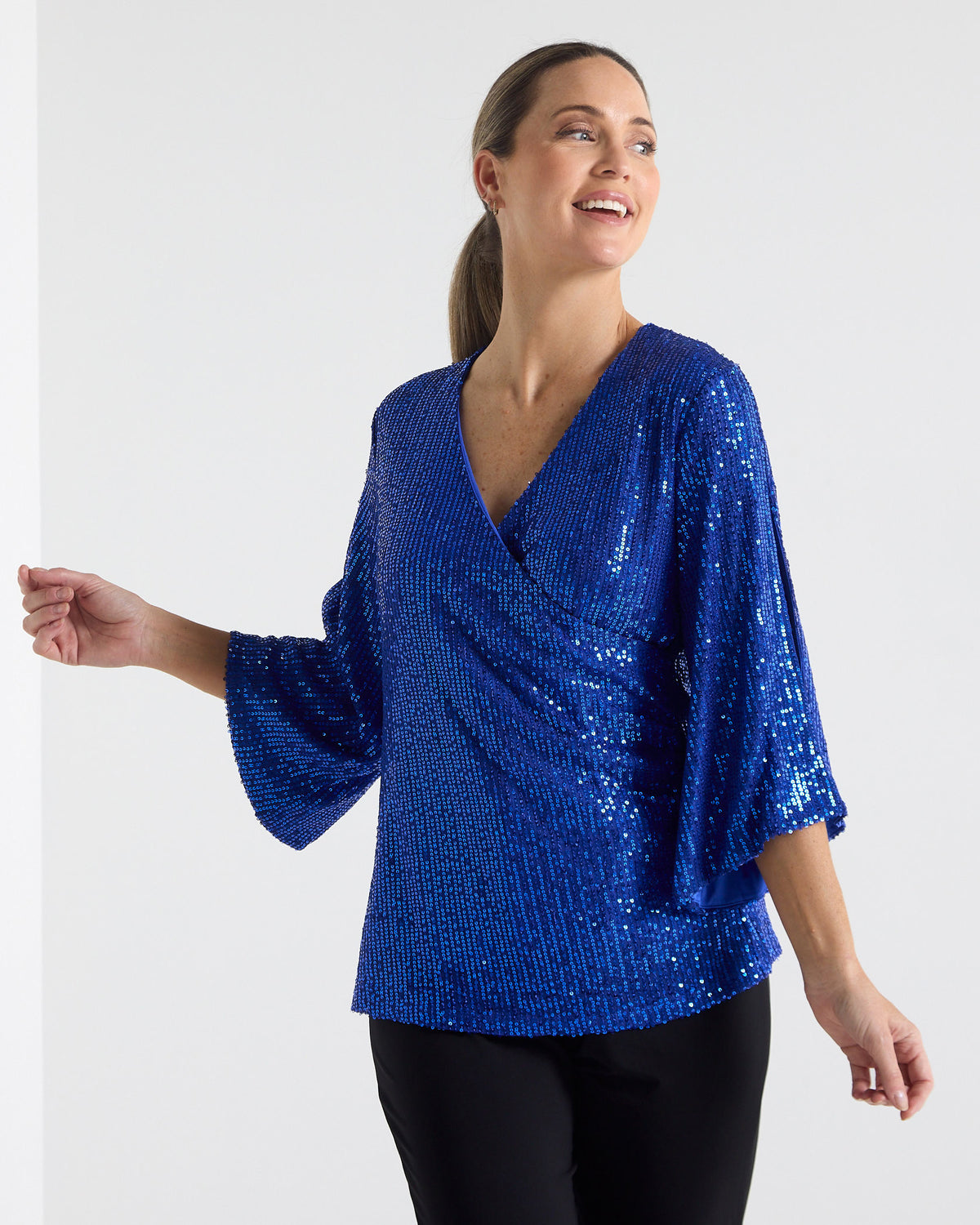 Sparkle Sequin Top in electric blue, front view showing the flared sleeve movement