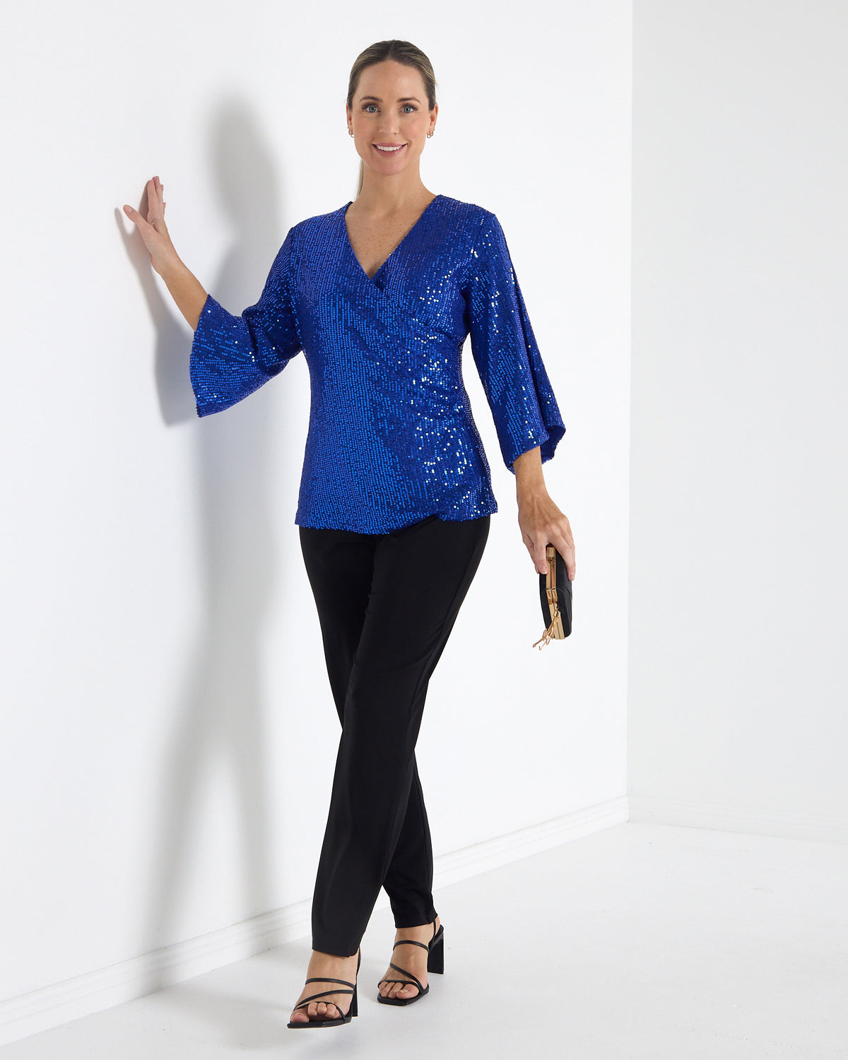 Sparkle Sequin Top in electric blue, full-length front view worn with black pants