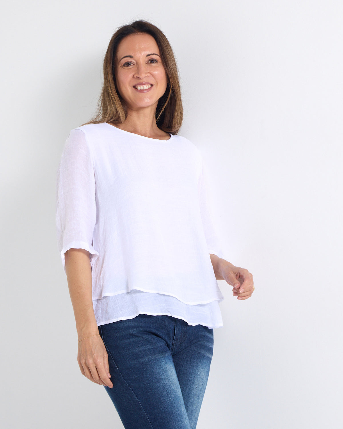Leo Layered Top in white, three-quarter view showing the sheer sleeves