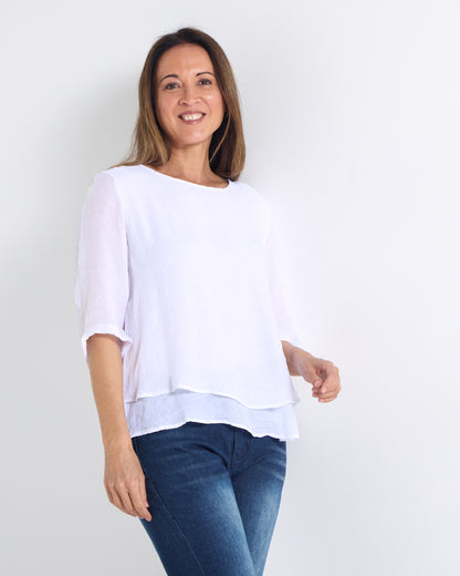 Leo Layered Top in white, three-quarter view showing the sheer sleeves