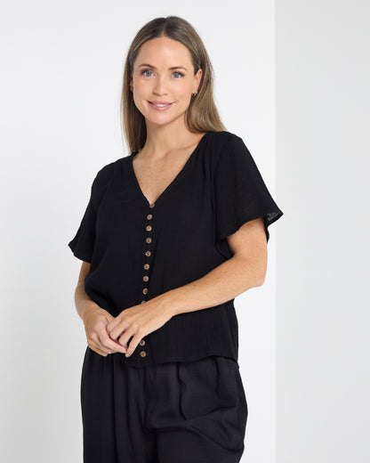 Tarin Button Top in black, front view showing the relaxed fit and short sleeves