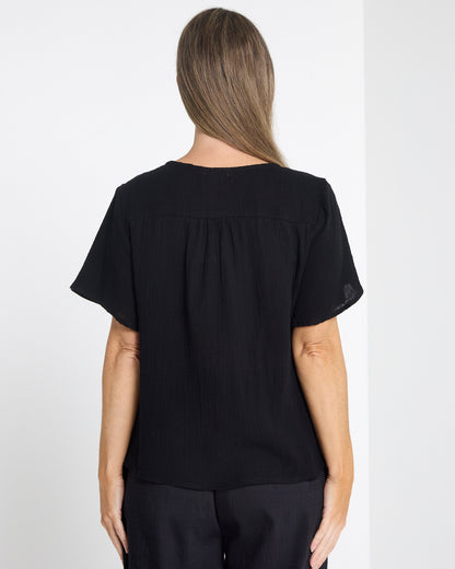 Tarin Button Top in black, back view showing the plain back and short sleeves