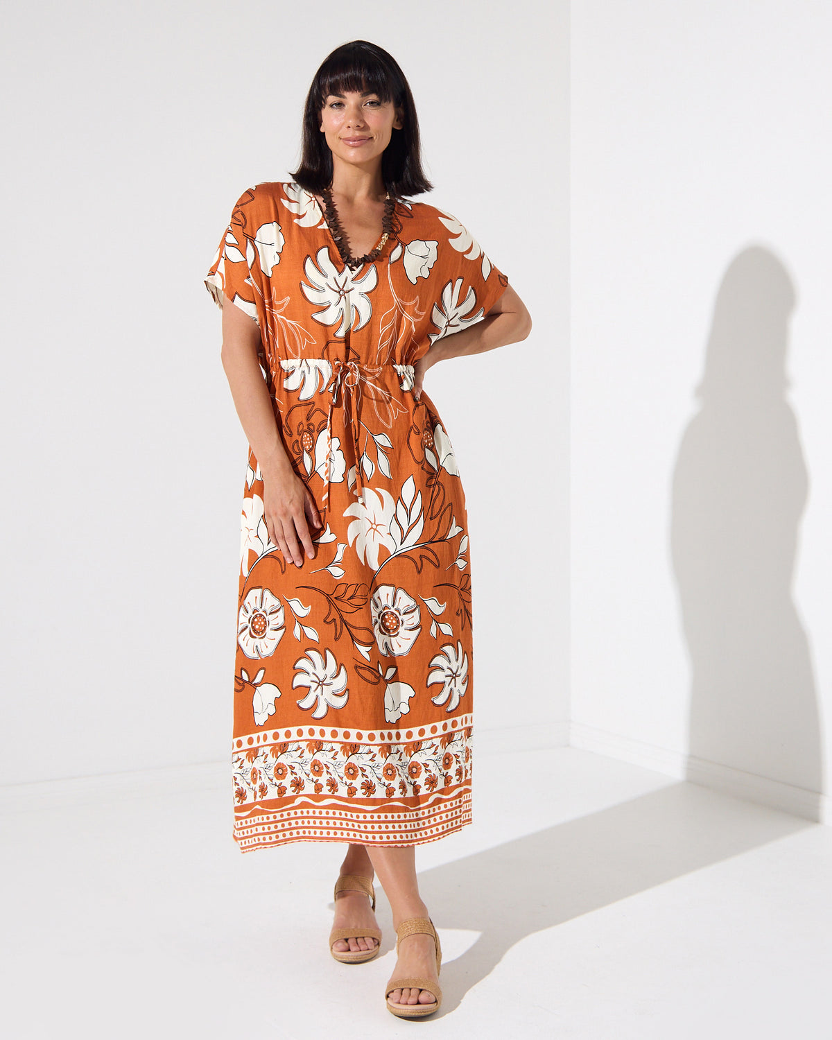 Montgomery Dress in toffee, front view showing kimono sleeves and drawstring waist