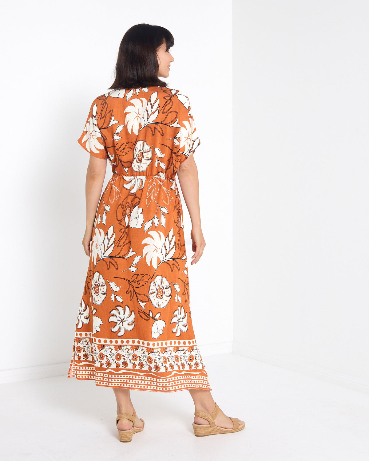 Montgomery Dress in toffee, back view with border print hem