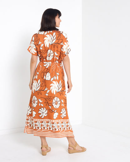 Montgomery Dress in toffee, back view with border print hem