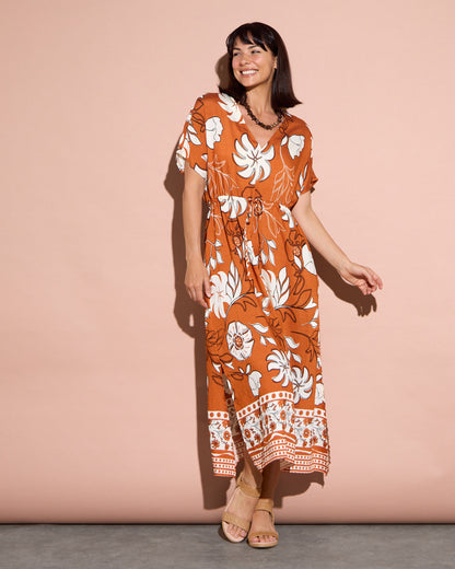 Montgomery Dress in toffee, full-length view in motion showing the kimono sleeves