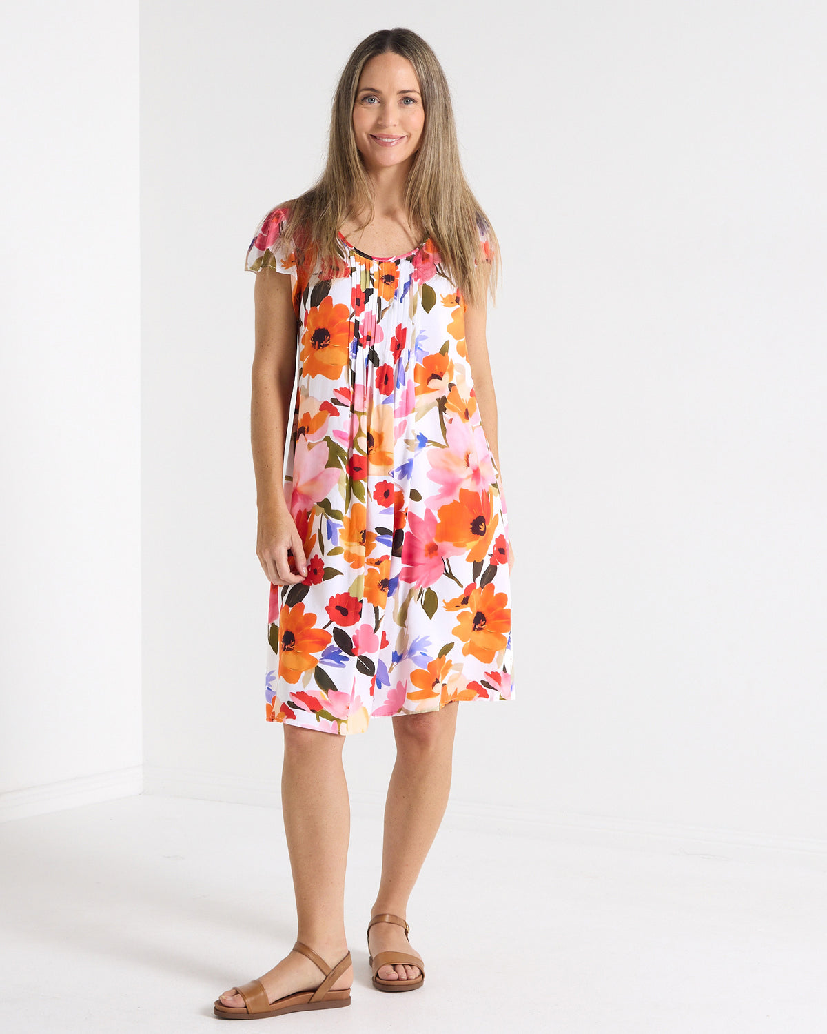 Paige Pintuck Dress in floral print, full-length front view with cap sleeves and round neckline