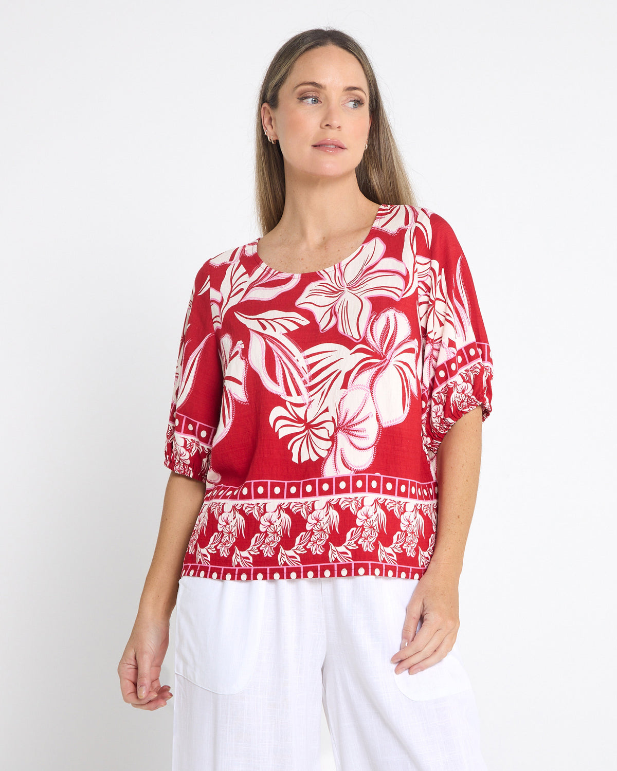 Falkiner Border Print Top in red, front view showing the red and white floral print and border hem