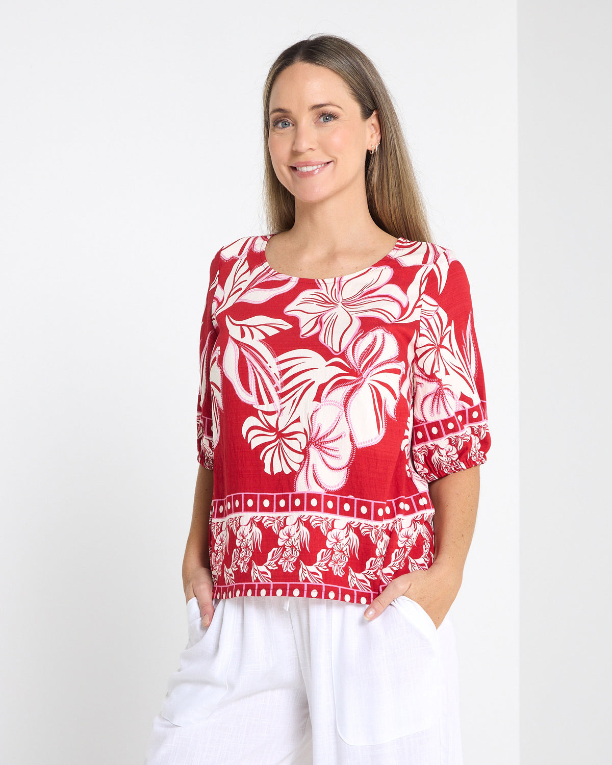 Falkiner Border Print Top in red, front view worn untucked with white pants