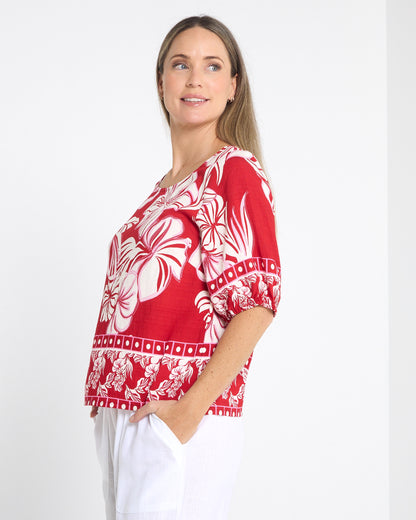 Falkiner Border Print Top in red, side view showing the sleeve and length
