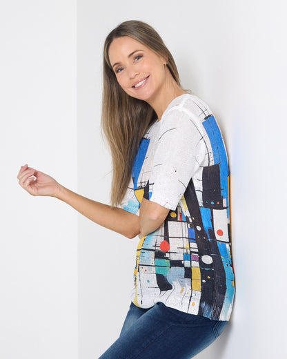 Caprina Knit Top in colour blocks, side view showing the relaxed fit